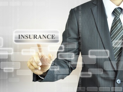 Insurance agent pointing to a graphic that says "insurance"